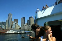 Ferry passengers and the department of Homeland Security security boat riding alongside
