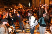 IMAGE: Revelers take to the streets after Obama